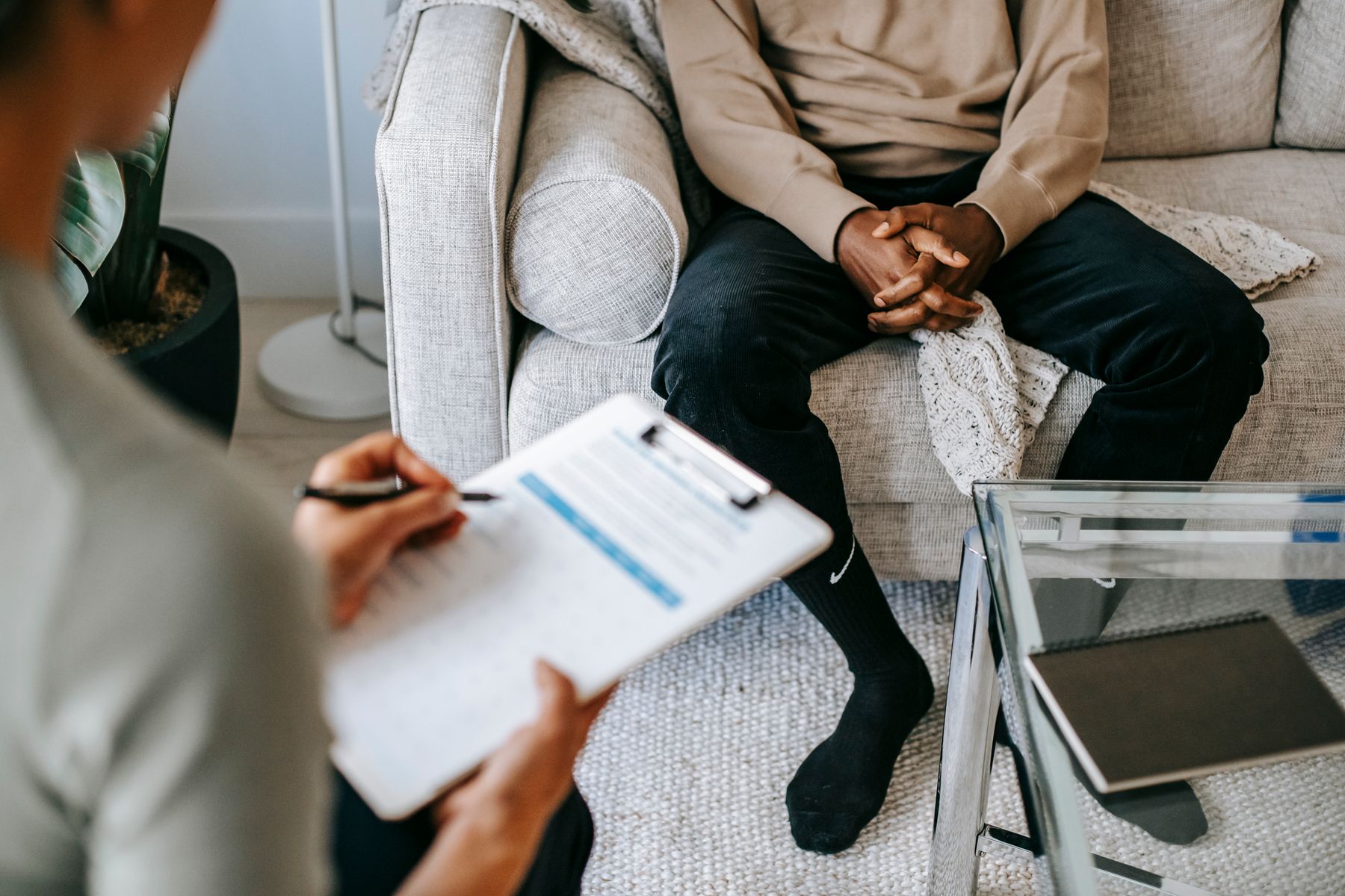 Therapist and client seated in conversation in a quiet consulting room