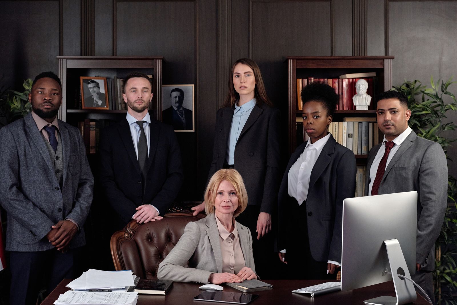 Group of lawyers standing together in a law firm office