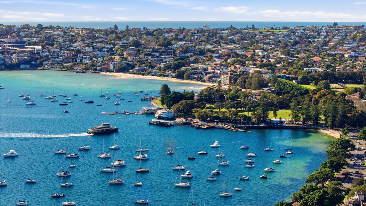 Aerial view of a Sydney Northern Beaches harbour bay with moored boats