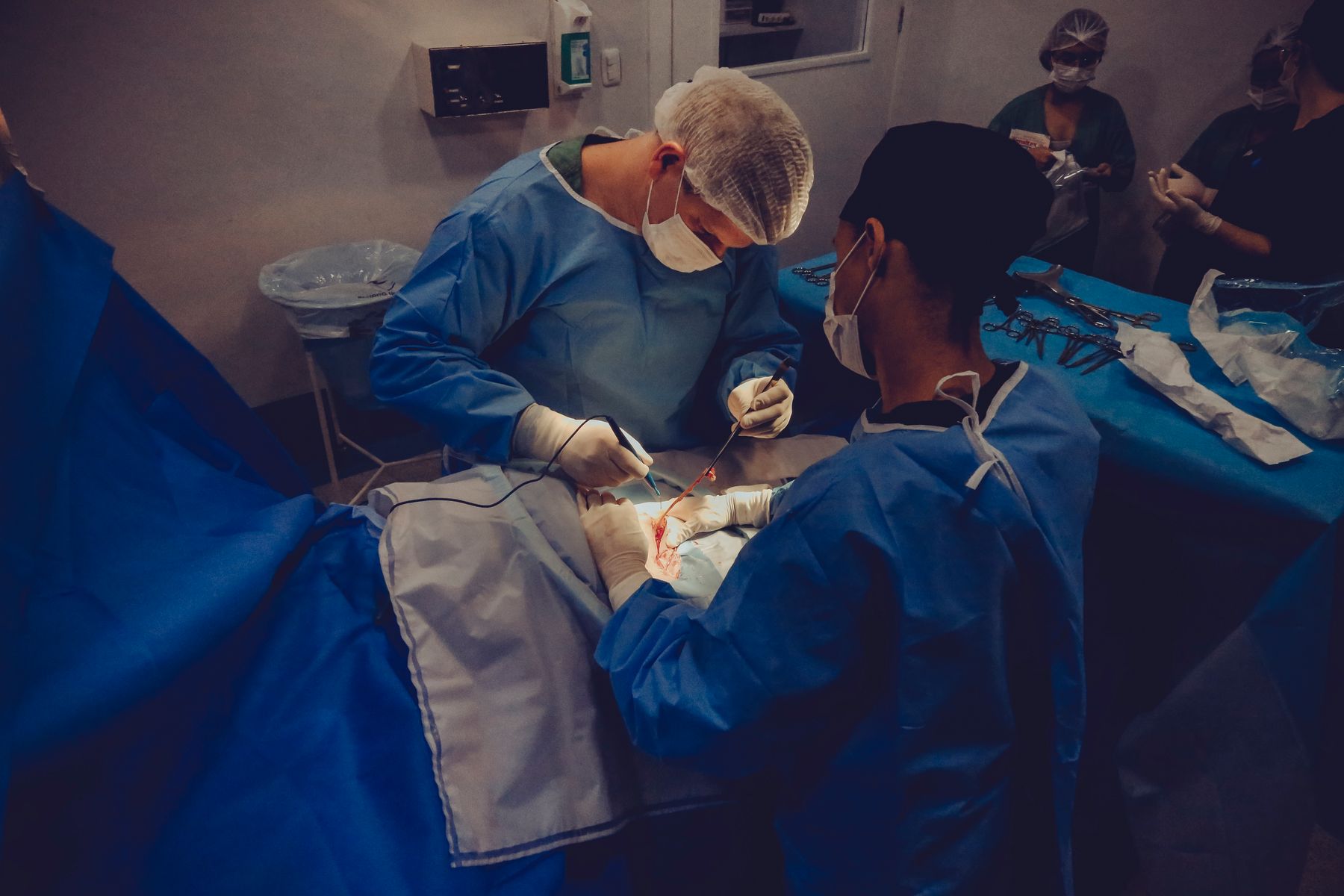 Surgical team operating in a hospital theatre